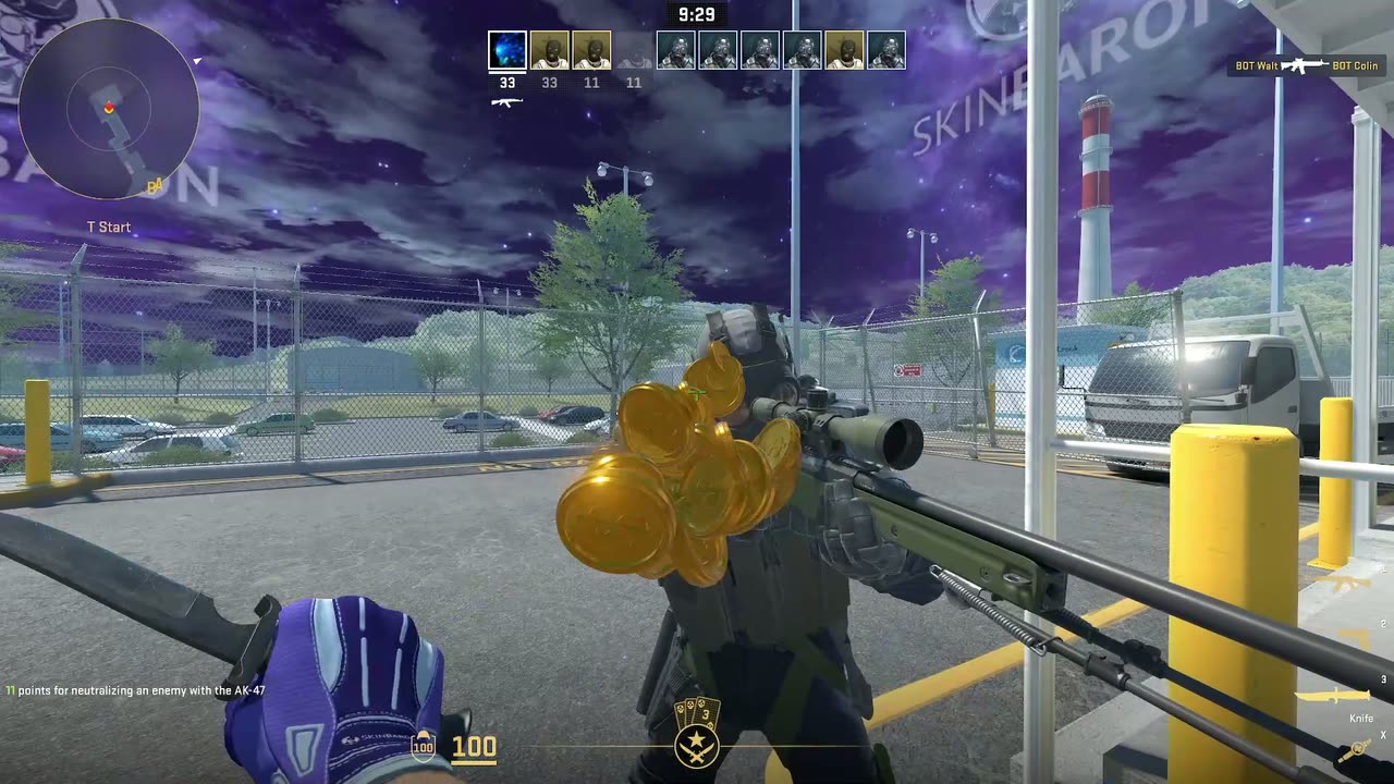 Counter-Strike 2 gameplay: a purple branded skybox above the map and SkinBaron artwork on a cooling tower
